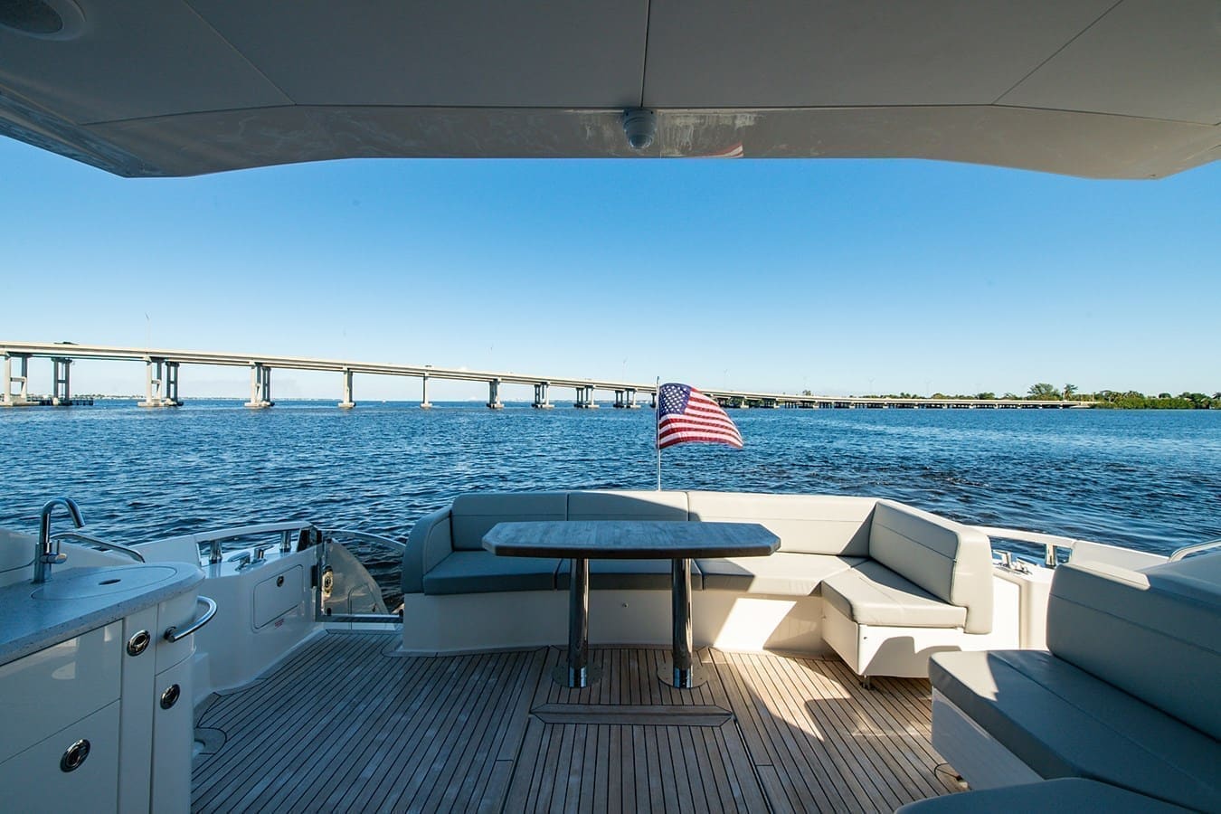 Aft deck view toward a long coastal bridge