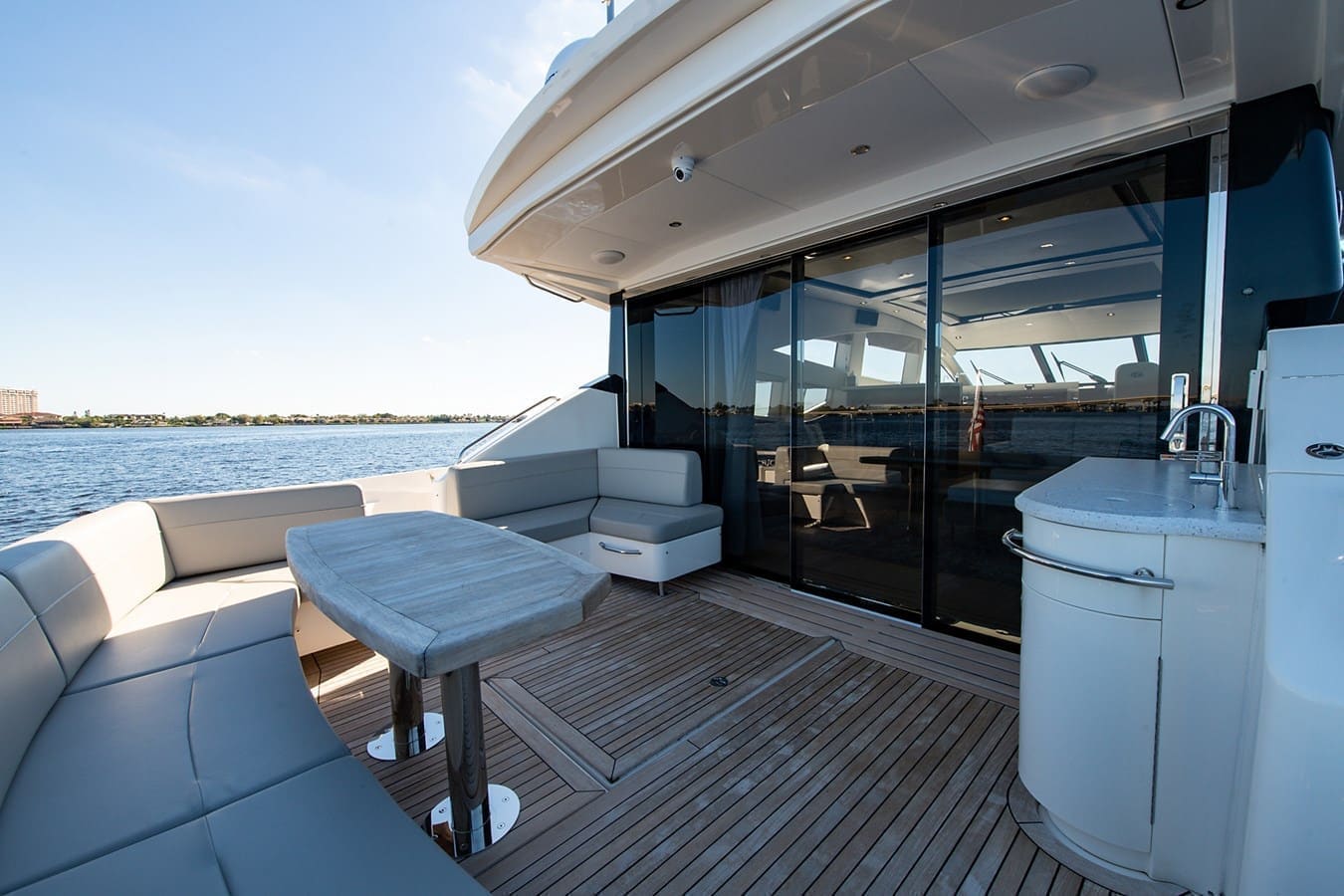 Aft deck opening through glass doors into the salon