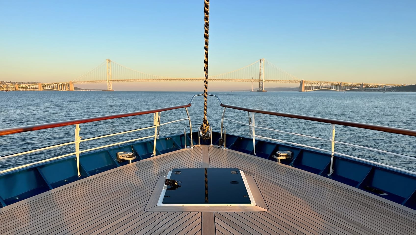 Aft deck view toward a long coastal bridge