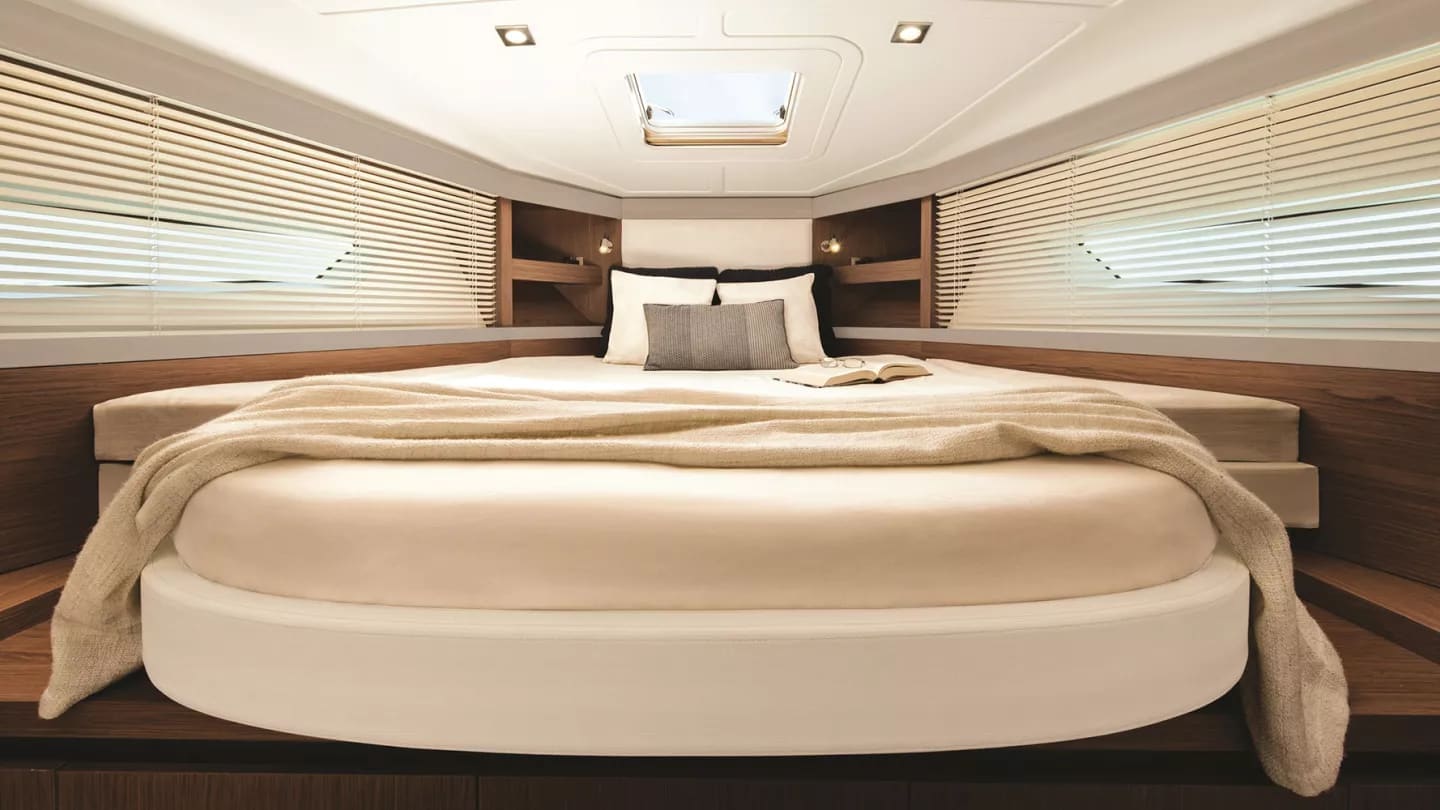 Master cabin with a round berth and soft ambient lighting