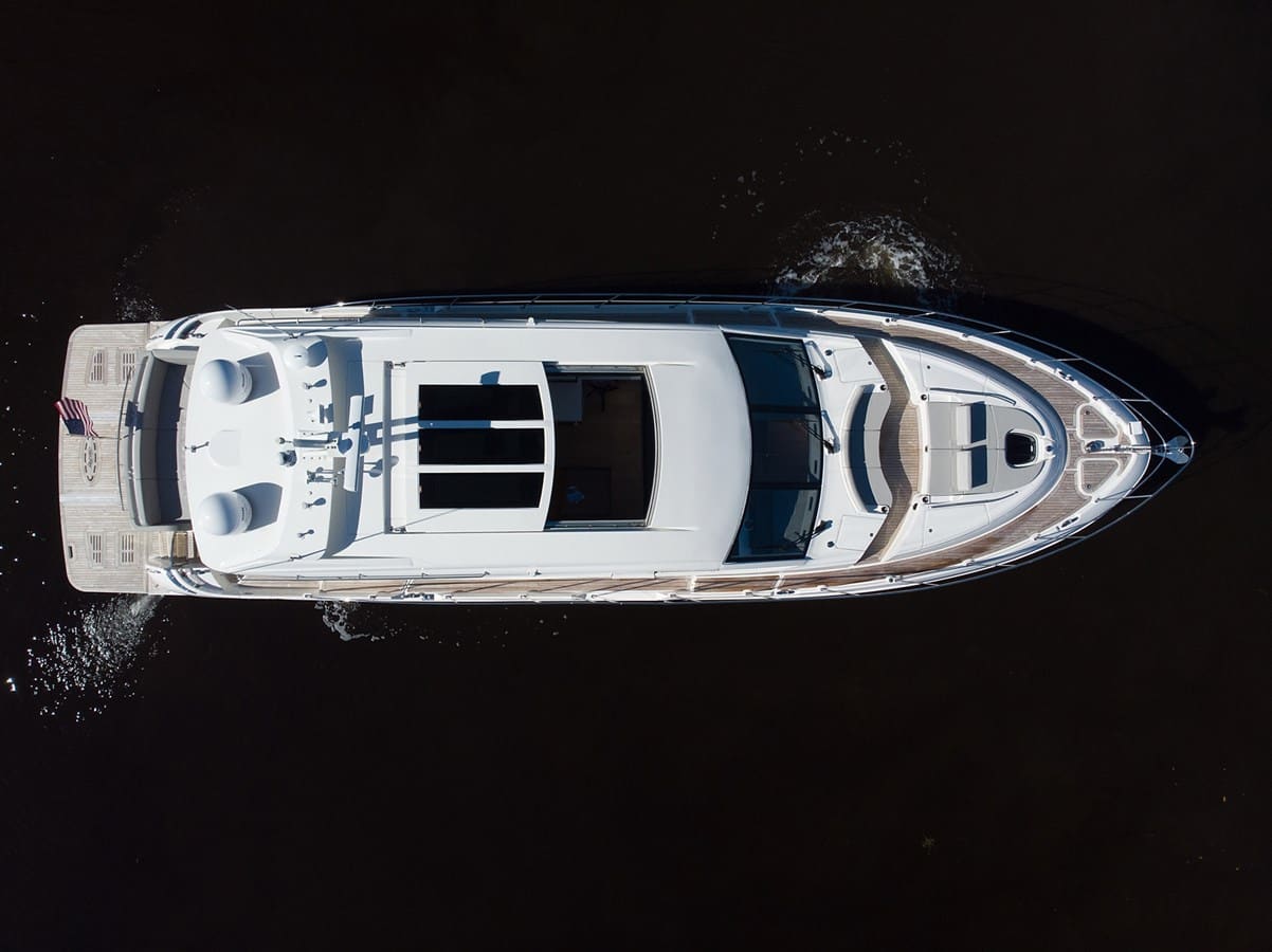 Top-down aerial of the L-Class 650 under way at night-dark water