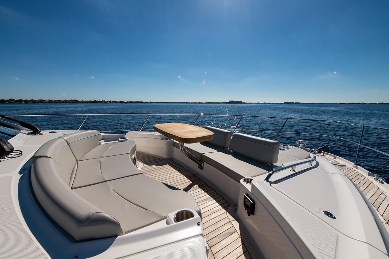 Bow lounge seating and teak table on the foredeck