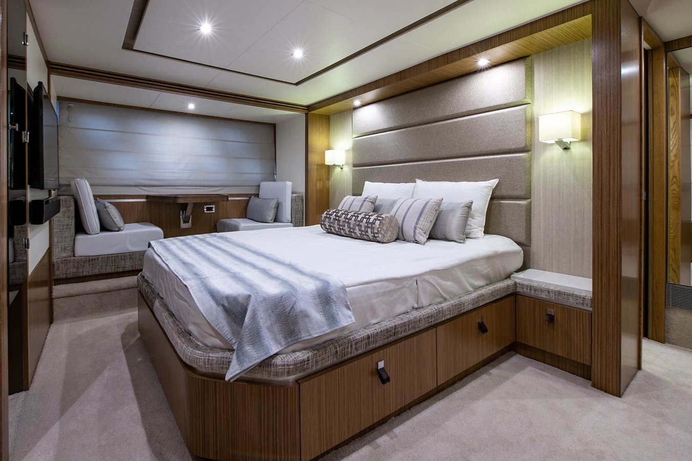 Master stateroom with a private lounge and wraparound windows