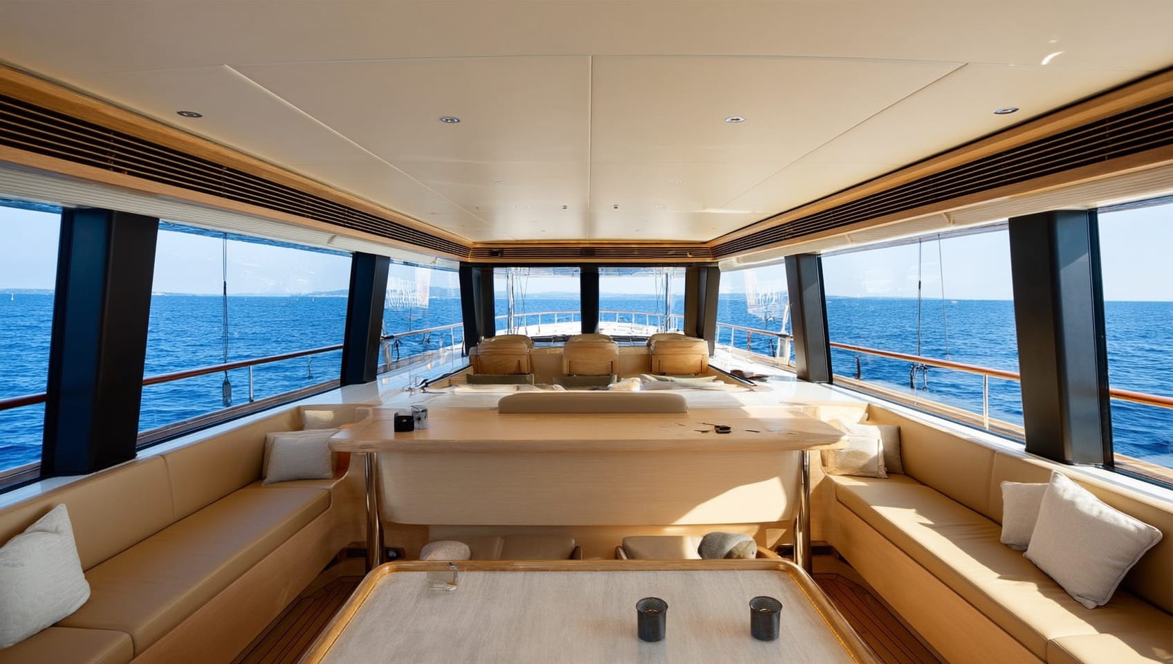 Bright main salon of the L-Class 650 with wraparound windows