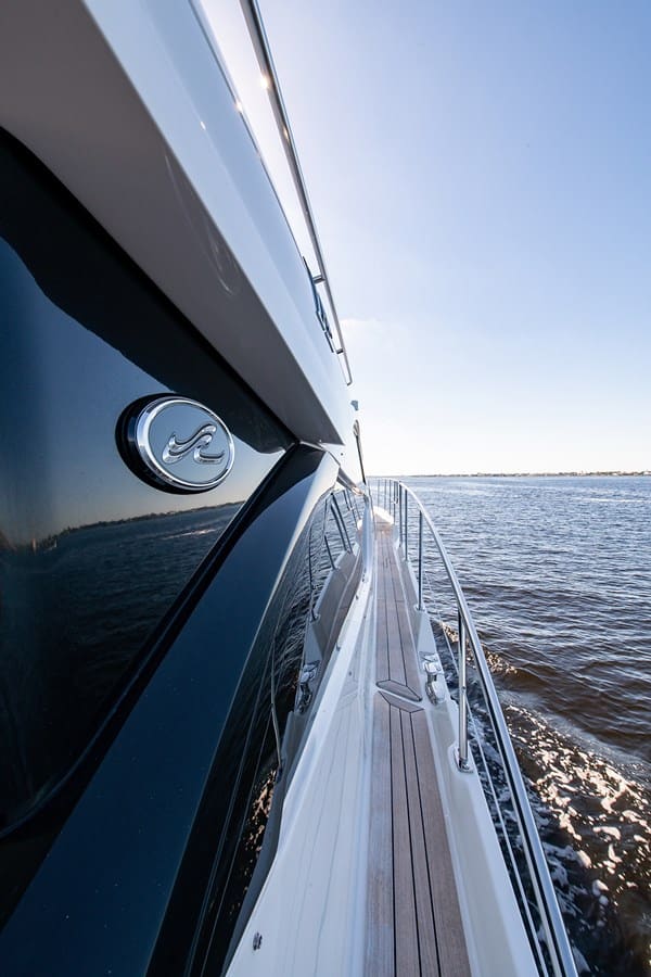 Looking down the teak side deck toward the bow